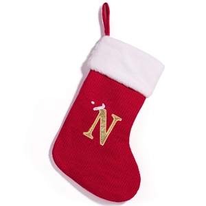 Red Christmas stocking with white fur trim and gold embroidered letter N decoration