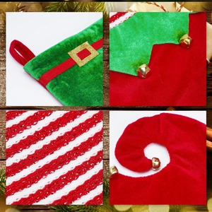 Macro detail of Christmas elf stocking with golden bells and red sequined stripes