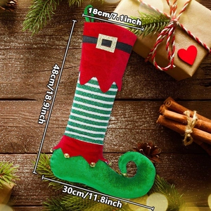Close-up of elf Christmas stocking with bells on wood background showing 48cm size details