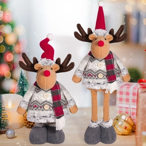 Detail of Christmas reindeer plush toys with telescopic legs and knit snowflake sweaters