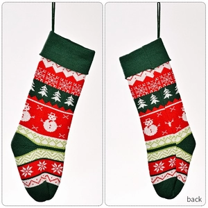 Front and back detail view of knitted Christmas stocking with snowflake and tree patterns