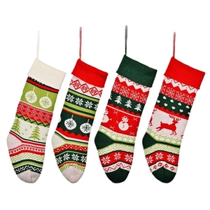 Set of 4 knitted Christmas stockings with festive patterns like elk and snowflakes
