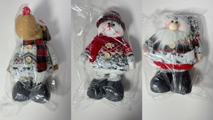 Three Christmas plush dolls featuring reindeer snowman and Santa with knitted sweaters