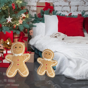 Christmas gingerbread man plush pillows in two sizes with festive indoor holiday decor
