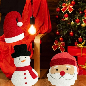 Cozy Christmas plush pillows with Santa and snowman designs in festive living room