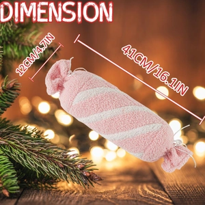 Détail montrant les dimensions du coussin en peluche bonbon rose et blanc de Noël