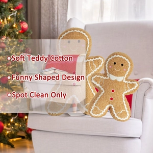 Detail of plush gingerbread man pillows in soft brown teddy cotton with festive decor