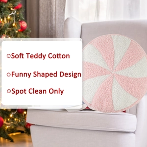 Detail of pink and white spiral candy plush pillow made of soft teddy cotton material