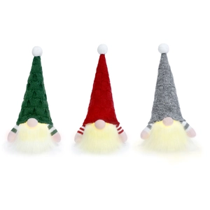 Three glowing Christmas gnomes with LED lights, knitted hats in red, green and grey