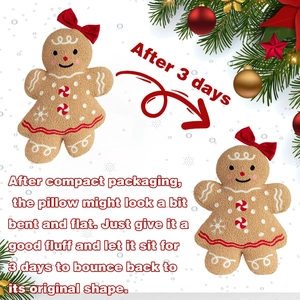 Detail of plush gingerbread man pillow with red bow and soft snowflake embroidery