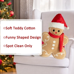 Detailed view of gingerbread man plush pillow with red scarf on a cozy sofa