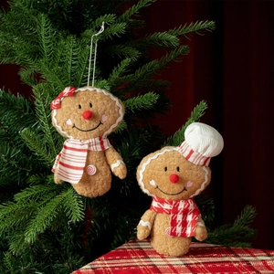 Christmas gingerbread man plush ornaments with red bows on a festive tree background
