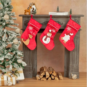 Set of 3 plush red velvet Christmas stockings featuring elk, snowman, and polar bear designs