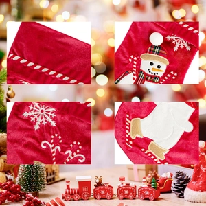 Plush red velvet Christmas stocking with embroidered snowman and snowflake patterns