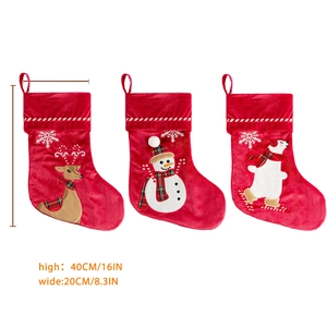 Three-piece red velvet Christmas stockings with reindeer, snowman, and polar bear embroidery