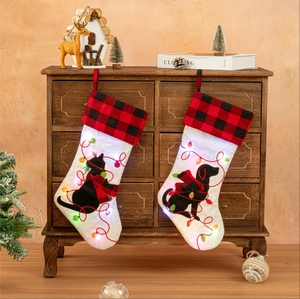 Luminous Christmas stockings with cat silhouette, buffalo plaid and LED lights