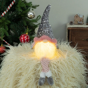 Lighted Christmas gnome with grey sequin hat and striped long legs for holiday home decor
