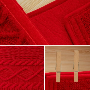 Red cable knit Christmas tree skirt with festive braided textures and satin ribbon trim