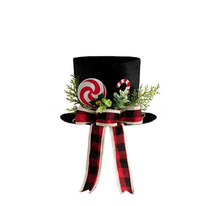 Christmas tree topper black hat with buffalo plaid bow and red white candy decorations
