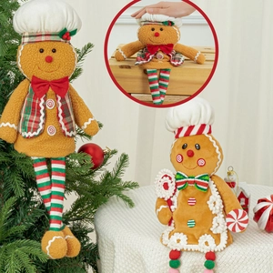 Detail of plush gingerbread man dolls in chef hats and plaid festive holiday costumes
