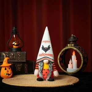 Detail of Halloween gnome doll with Happy Halloween hat on vintage velvet backdrop