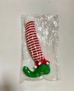 Christmas plush doll legs with red-white stripes and curly green felt boots in packaging
