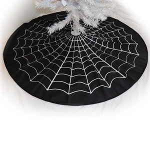 White spider web pattern on black Christmas tree skirt for Halloween holiday decoration
