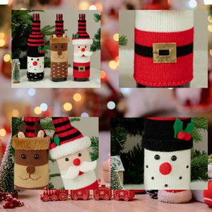 Macro shot of knitted Christmas wine bottle covers with 3D snowman and reindeer details