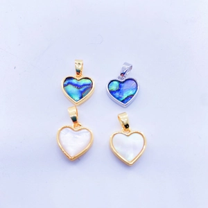 Heart pendants in abalone and white shell with gold and silver zircon frames