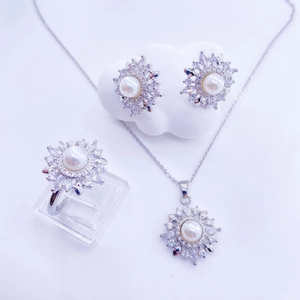 Three-piece sunflower jewelry set with white pearls and zircons on silver metal base