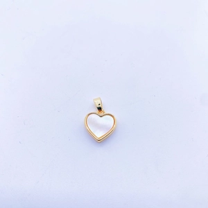 Detail of a heart-shaped pendant with white mother of pearl and gold-plated metal frame