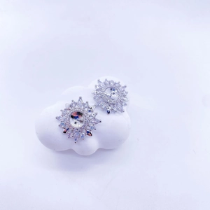 Detailed view of silver sunflower stud earrings with marquise cut sparkling stones