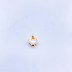 Close-up of heart pendant with gold copper frame and white mother of pearl inlay