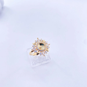 Detailed macro view of golden sunflower ring blank base with crystal petal embellishments