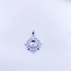 Macro shot of silver sunflower pendant setting with marquise cubic zirconia stones