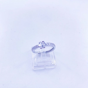 Macro shot of a floral silver-tone adjustable ring featuring sparkling zircon inlay details