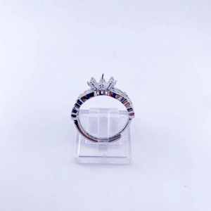 Macro detail of adjustable silver ring base with crown prong setting and pavé accents