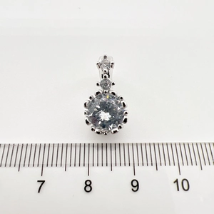 Detailed view of 15mm silver pendant with large 10mm round-cut cubic zirconia stone