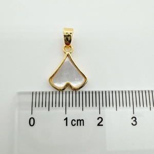 Measurement photo of a 18K gold-plated ginkgo leaf shell pendant on a metric ruler