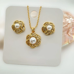 Elegant 925 silver camellia jewelry set with necklace and earrings featuring white pearls
