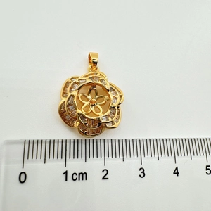 Close-up of 925 silver camellia flower pendant with cubic zirconia and 2cm measurement