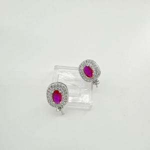 Detailed macro view of 925 silver earring mounts with oval pink stones and zircon halos