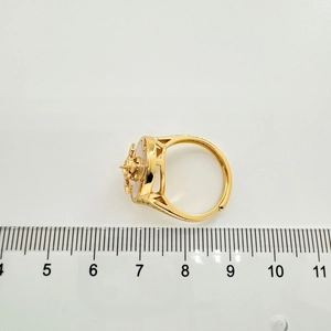 Detail view of adjustable gold ring mounting with 22mm diameter measurement on scale