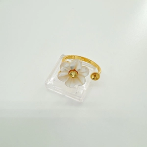 Detailed macro shot of floral adjustable s925 silver ring setting with mother of pearl petals