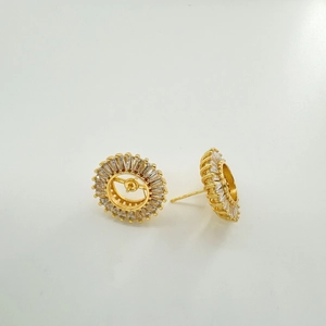 Macro detail of S925 silver sunflower earrings with zircon inlays and golden finish