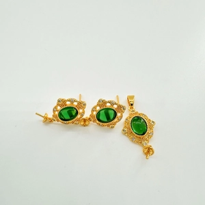 Detailed view of vintage gold hollow-out jewelry set with green zircon and DIY mounts