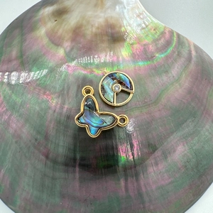 18K gold butterfly and round shell pendants with iridescent mother-of-pearl inlay
