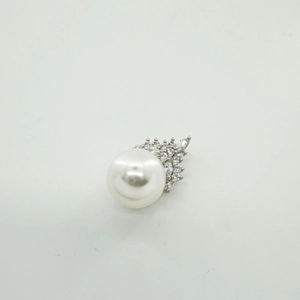 Close-up of pearl pendant with 18K gold plated crown base and sparkling zircon accents
