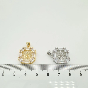 Detail of 15mm square floral pendants with micro-pave cubic zirconia in gold and silver