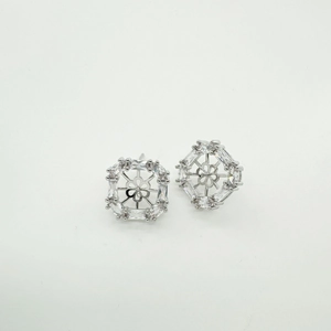 Detailed macro view of geometric zircon earring setting with 18K gold plated finish